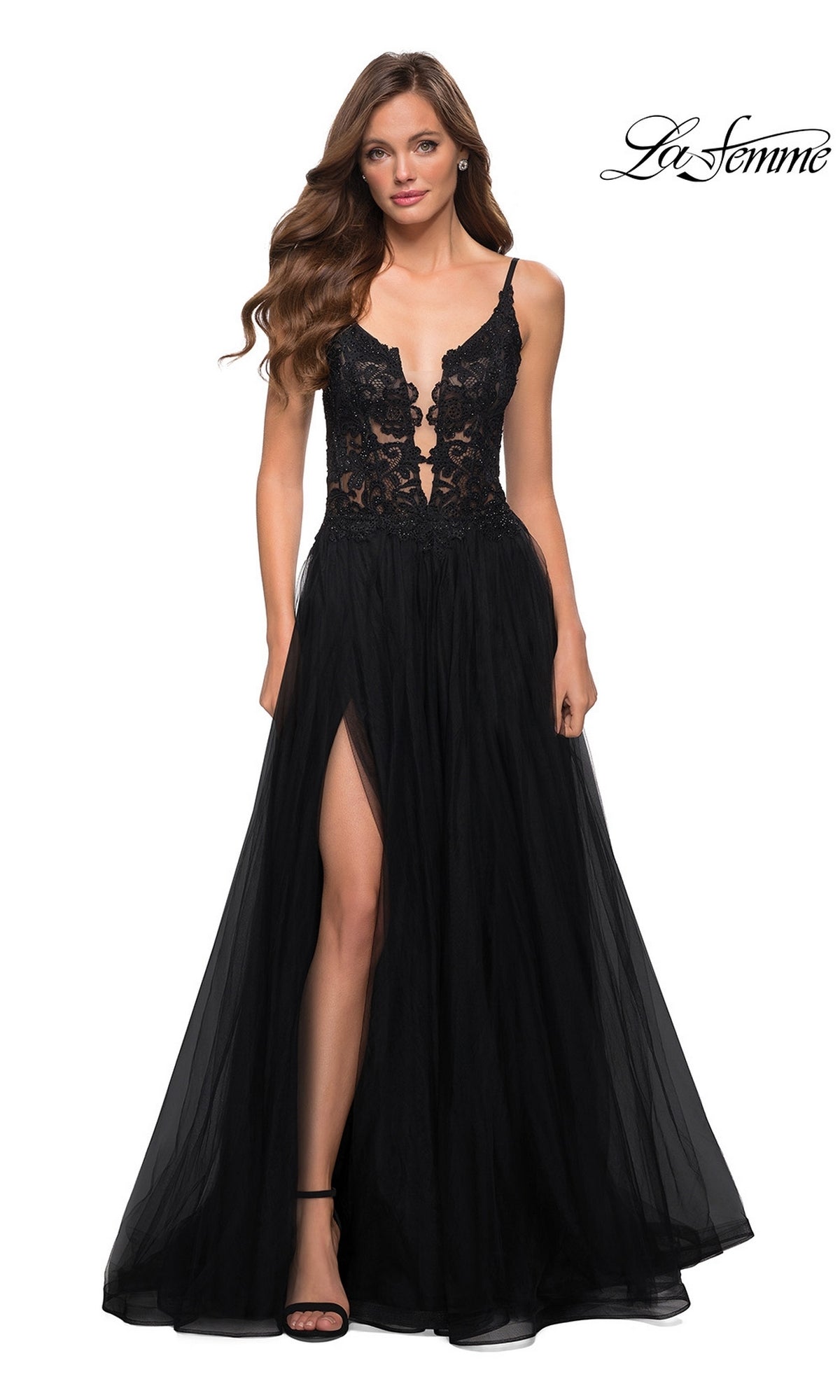 A woman models the La Femme Lace-Bodice Long A-Line Prom Dress 29686 in black, featuring embroidered lace on the bodice, spaghetti straps, and a thigh-high slit;